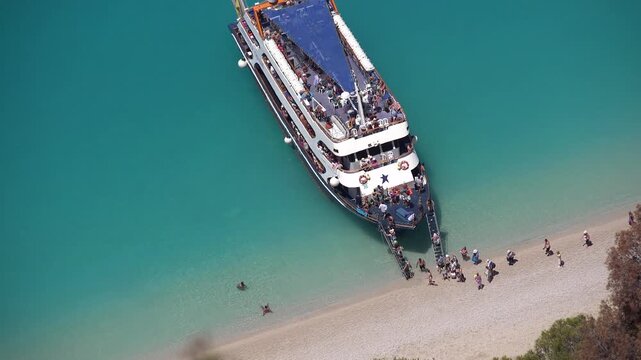 Ship on Egremni Beach in Lefkada, Greece, Cruise Sailing Trip, People in Boat