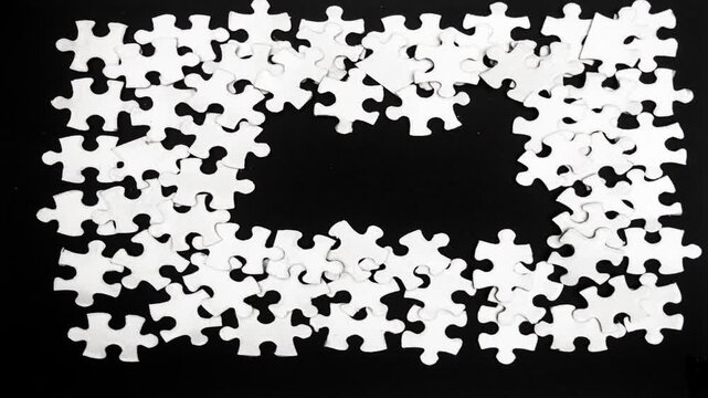 Jigsaw transition on black stop motion 