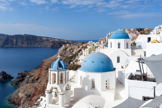 White church with blue dome in Oia, Santorini, Greece