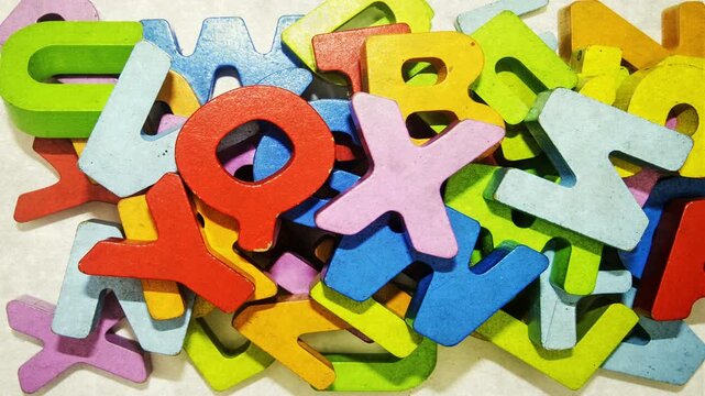 Big wooden letters piling up 