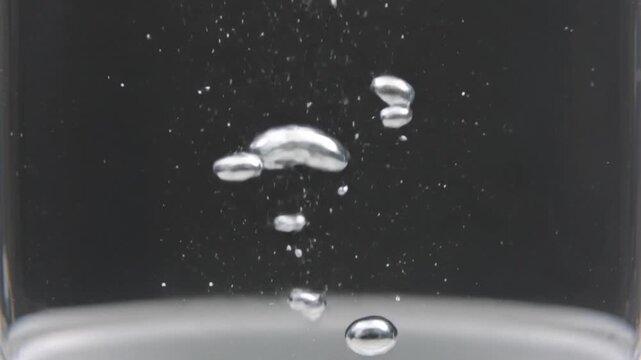 Carbonated Water Bubbles Rising Macro Close-Up, Sparkling Liquid Abstract Slow Motion Cinematic