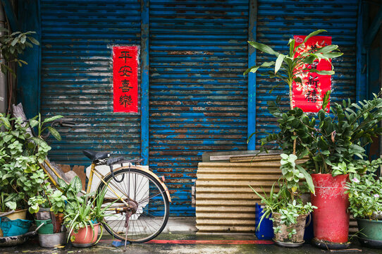 Bicycle and blue shutter in the streets of Taipei, Taiwan