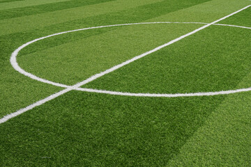 Naklejka premium Fresh green turf glows under bright light