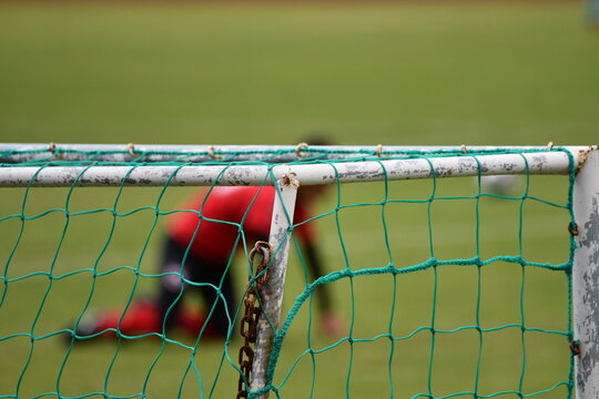 Baliza campo de futebol e jogador
