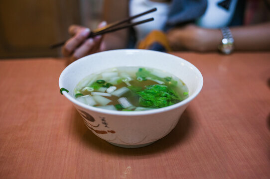 Close up of a hot vegetable soup bowl on a table in a Taipei restaurant, Taiwan
