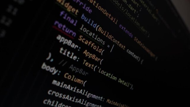 Monitor screen with programming code, programming language on the monitor screen close up