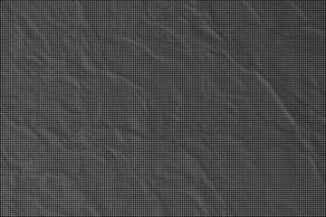 Fototapeta premium A close-up view of a rugged, dark gray rock surface with textured wrinkles and crevices.