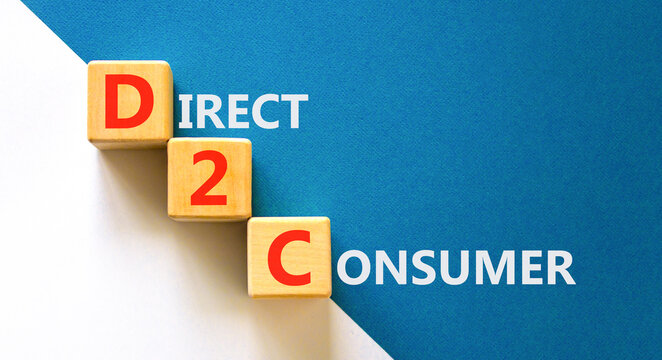 DTC direct 2 consumer symbol. Concept words DTC D2C direct 2 consumer on beautiful wooden cubes. Beautiful white blue background. Business DTC direct 2 consumer concept. Copy space.