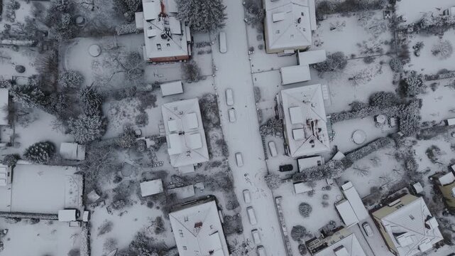 Berlin Germany, Winter flyover snow covered buildings after heavy snowfall