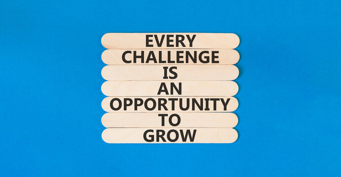 Challenge word symbol. Concept words Every challenge is an opportunity to grow on beautiful wooden sticks. Beautiful blue paper background. Business challenge is an opportunity concept. Copy space.