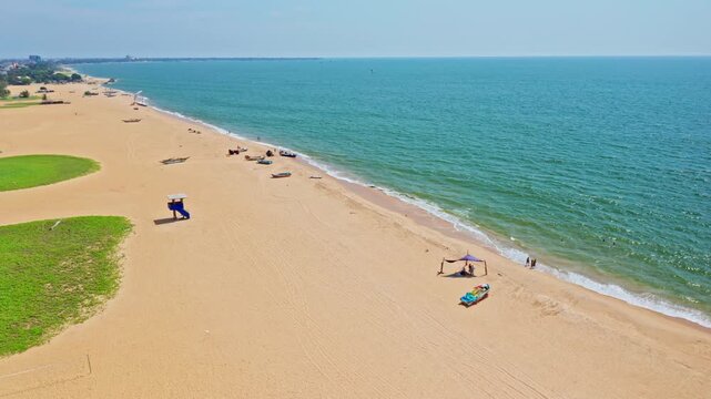 Aerial drone view of Negombo beach in Sri Lanka showing vast ocean, sandy shoreline and calm tropical coastal scenery.