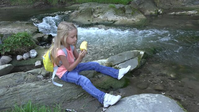 Child Eating Apples by River, Kid in Camping, Mountains View, Girl Eats Fruits