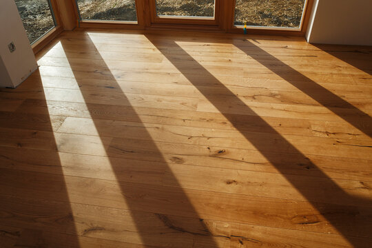 Empty room with finished parquet flooring
