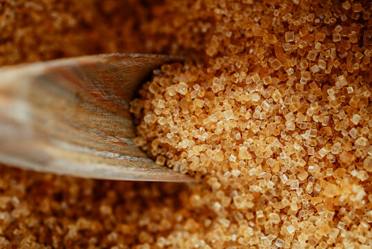 Wooden shovel in brown sugar
