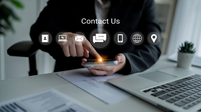 A business professional interacts with a smartphone to reach out for support, showcasing vital communication icons against a clean office background. Gantry