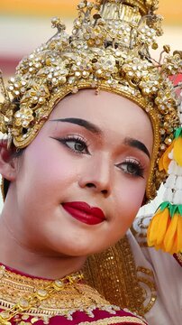 Close Up of Thai Khon Dancer in Traditional Gold Chada Headdress