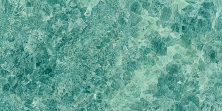 Crushed emerald green crystal pieces create a glittering, textured background, resembling precious gemstones or a vibrant, abstract natural formation.