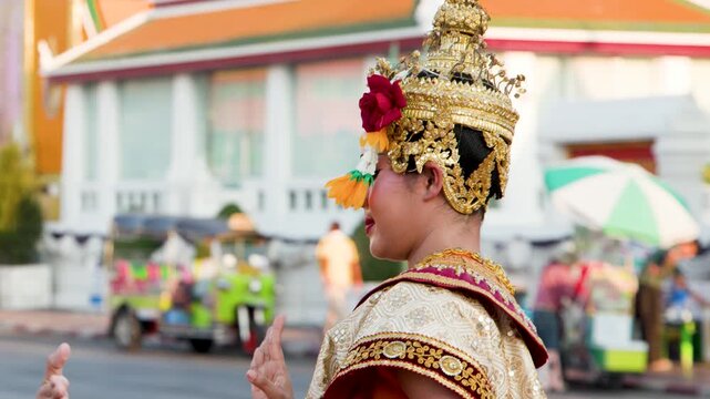 Traditional Thai Khon Dancer in Golden Costume at Wat Suthat Bangkok