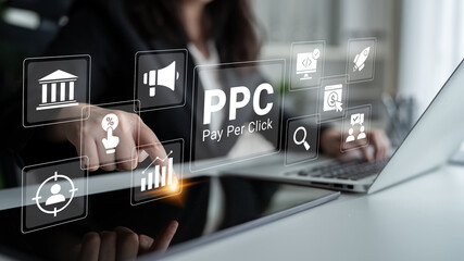 Naklejka premium A business professional interacts with digital marketing icons in a modern workspace, illustrating essential elements of pay per click advertising and strategic analysis. Ledger