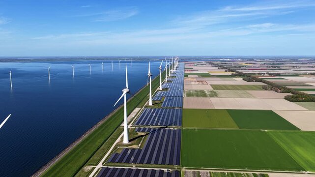 Renewable energy, windmills and solar panels.