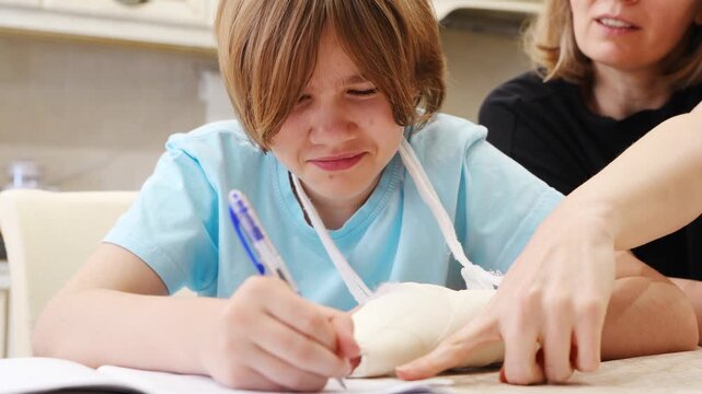 Girl learns to write with injured hand in home setting
