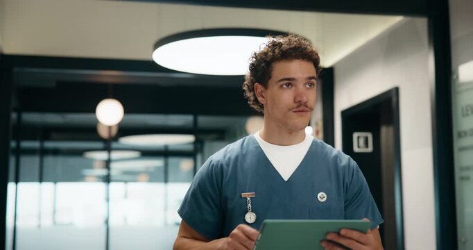 Medical, doctor and man with tablet in clinic for online report, schedule or results. Nurse, walking and thinking with digital app for healthcare records, treatment or update on surgery in hospital