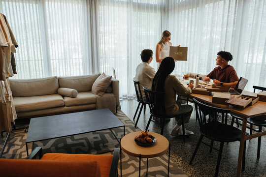 Young professionals collaborating during a casual business presentation in a modern workspace