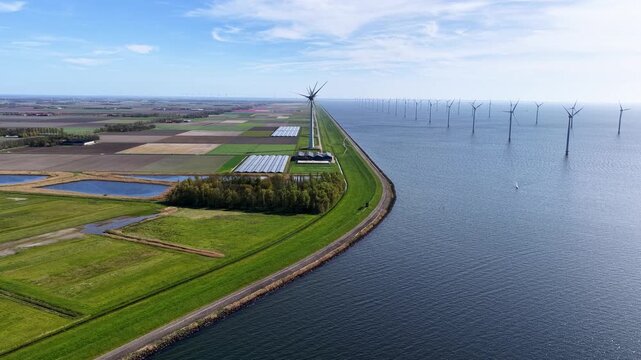 Renewable energy, windmills and solar panels.