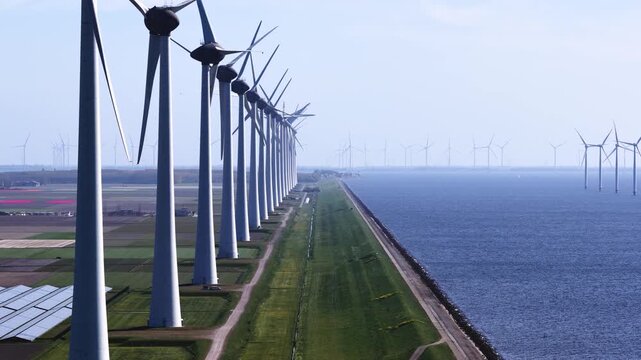 Renewable energy, windmills and solar panels.