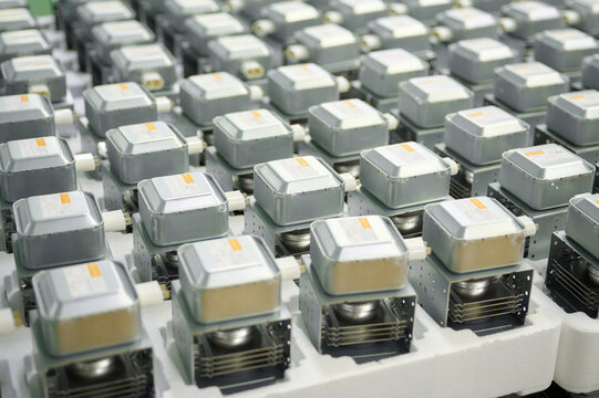 Magnetrons lined up for quality control process in a manufacturing facility for microwave ovens