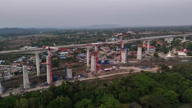 Aerial construction scene of elevated rail bridge for Thailand&rsquo;s future high-speed train network.