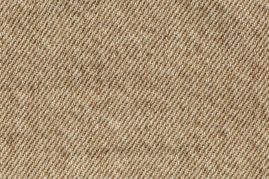 macro of beige jeans denim fabric texture