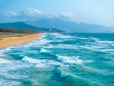 aerial view of waves on the beach