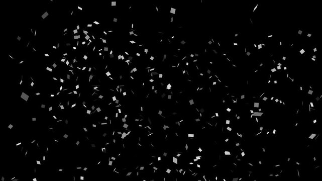 Computer animation of silver confetti exploding on black background with alpha channel. Concept of celebration, birthday, congratulations, party, event, holiday, overlay, decoration and festival.