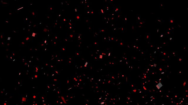 Computer animation of red confetti exploding on black background with alpha channel. Concept of celebration, birthday, congratulations, party, event, holiday, overlay, decoration and festival.