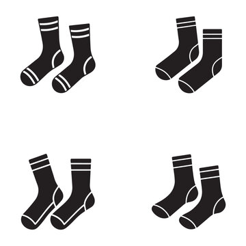 Four pairs of black socks with white stripes on a plain white background for fashion or clothing concepts  various styles and orientations