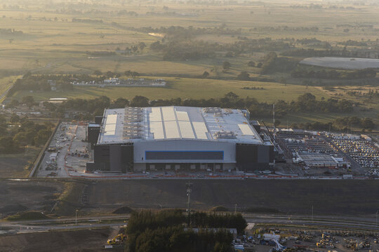 Craigieburn, Australia - 30 April 2026: Aerial view of the industrial facility at 65 Amaroo Rd surrounded by green fields and trees under a hazy morning sky.