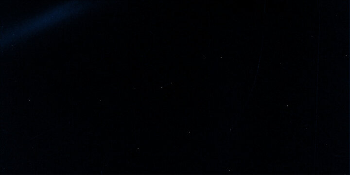 An abstract blue background animation features a loop of magical light particles and dark smoke swirling like a bright cosmic explosion in the night space
