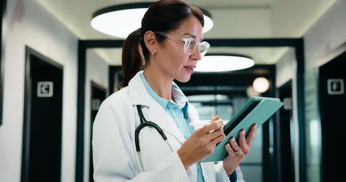 Medical, doctor or smile with tablet in hallway for healthcare report, clinical notes or insight. Thinking, mature physician or stylus for digital records, review consent form or prescription renewal