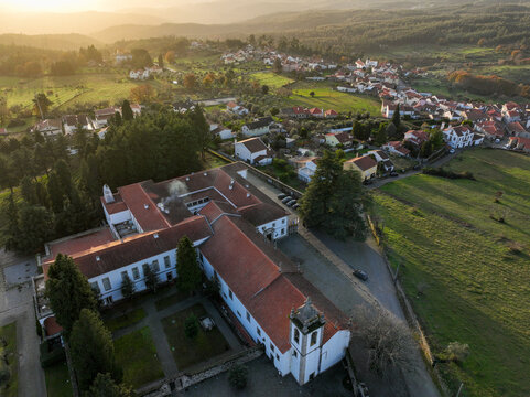 Vila Pouca da Beira, Portugal - 31 December 2023: Aerial view of Lam Hotel Convento do Desagravo with its historic red-tiled roofs and bell tower overlooking the village and hills.