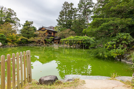 Garden design with natural balance and calm reflective surface in cultural environment, Kyoto, Japan 