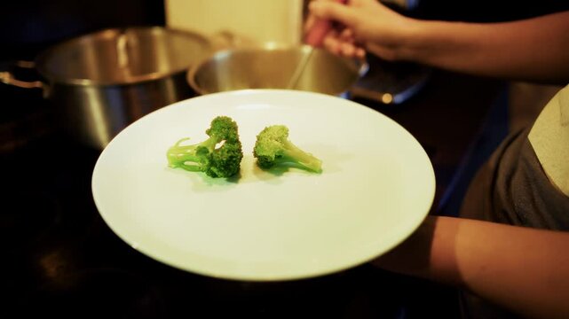  Placing Boiled Green Broccoli Onto Plate With Skimmer. Fresh Healthy Vegetables. Preparing Vegetarian Meal 