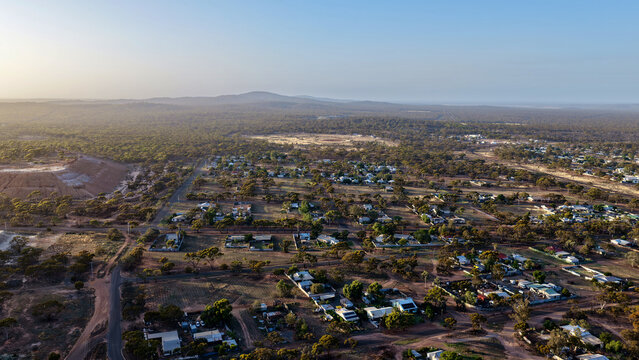 Norseman, Western Australia &ndash; 4K Aerial Drone Footage of Mining Site, Residential Houses and Estates, Lake, Forest and Remote Australian Outback Landscape at Sunrise 