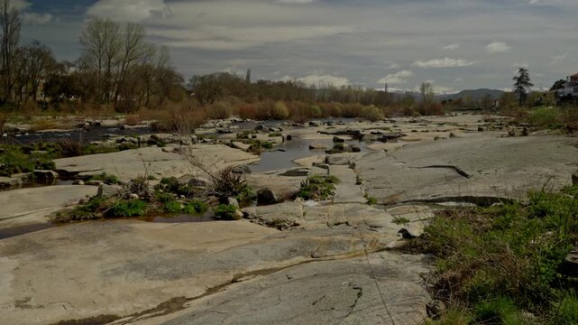 Agueda river flowing low through an exposed rocky riverbed near Puente del Co...