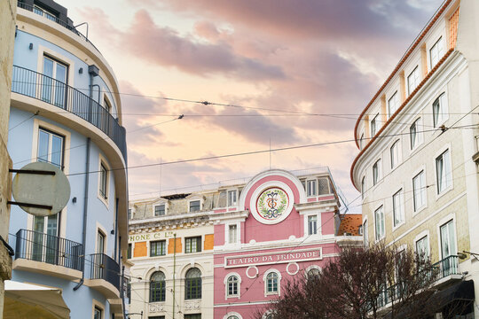 Exploring streets of Lisbon near Teatro da Trindade during sunset hours