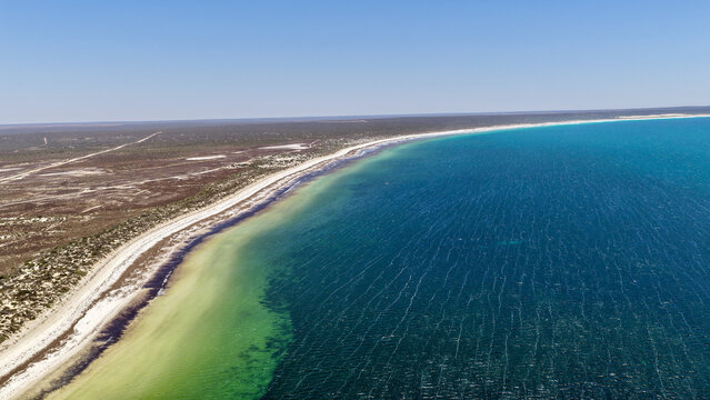 Scott Bay, Fowlers Bay, South Australia &ndash; 4K aerial drone view of Great Australian Bight coastline, turquoise ocean, sand dunes, jetty, white sand beach and limestone cliffs