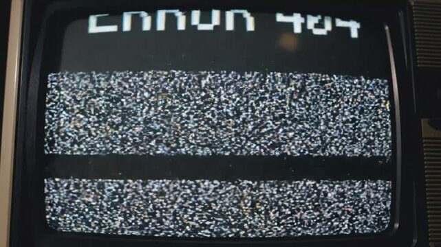 Retro television screen displaying Error 404 message with heavy glitch and static interference