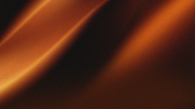 Orange, brown, and black colors that resemble folds of fabric or sand dunes in low light. The texture appears grainy, giving it a cinematic or artistic feel