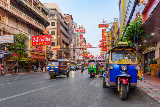 Blue tuk-tuk parked on Yaowarat Road at Chinatown of Bangkok