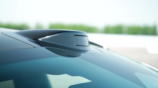 Detailed shot of a modern electric vehicle with LiDAR sensor technology at Geely Intelligent Mobility Center in China, showcasing autonomous driving innovation. UHD.